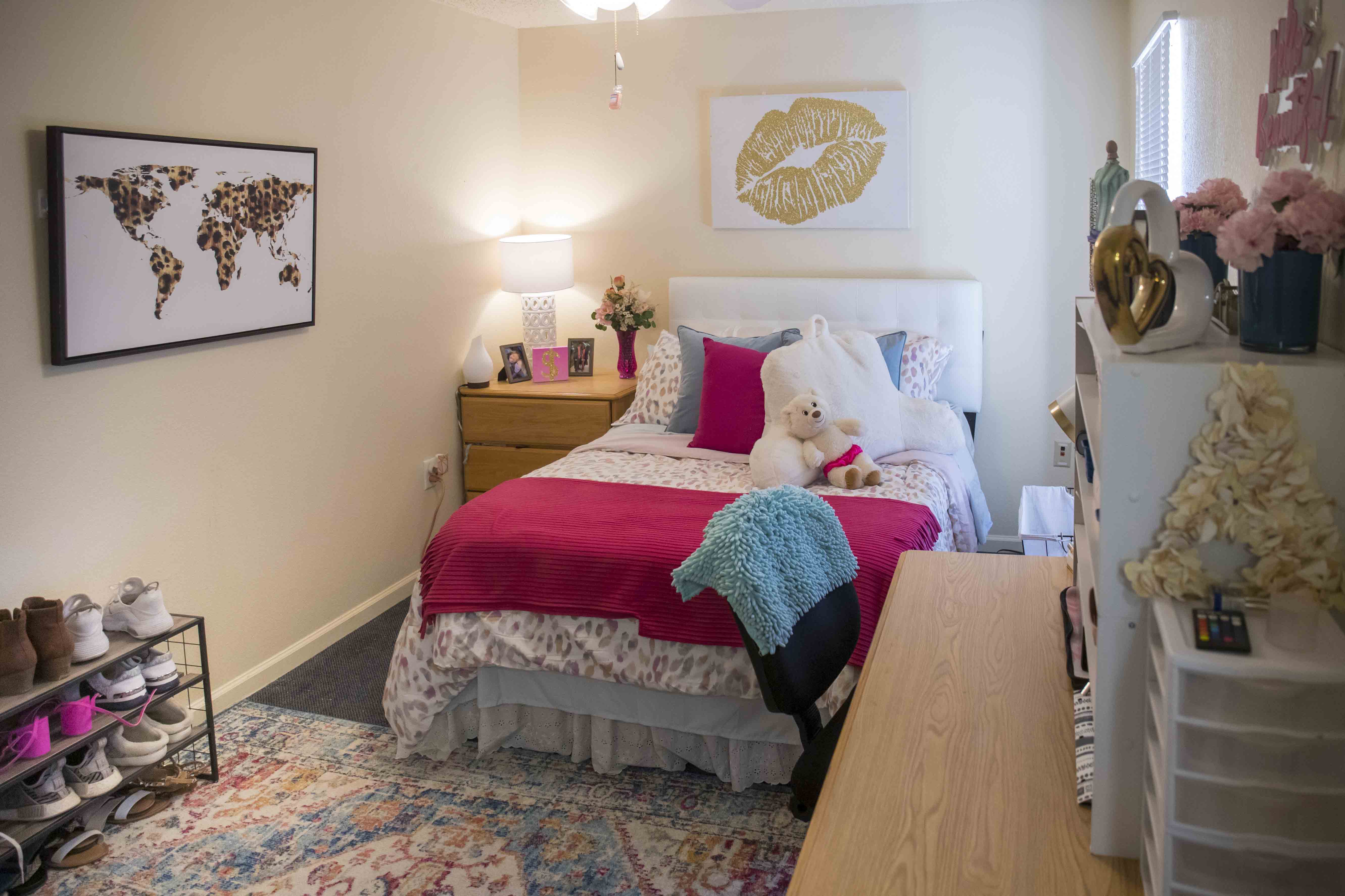 Booker & Stintchcomb bedroom decorated with white blue and pink