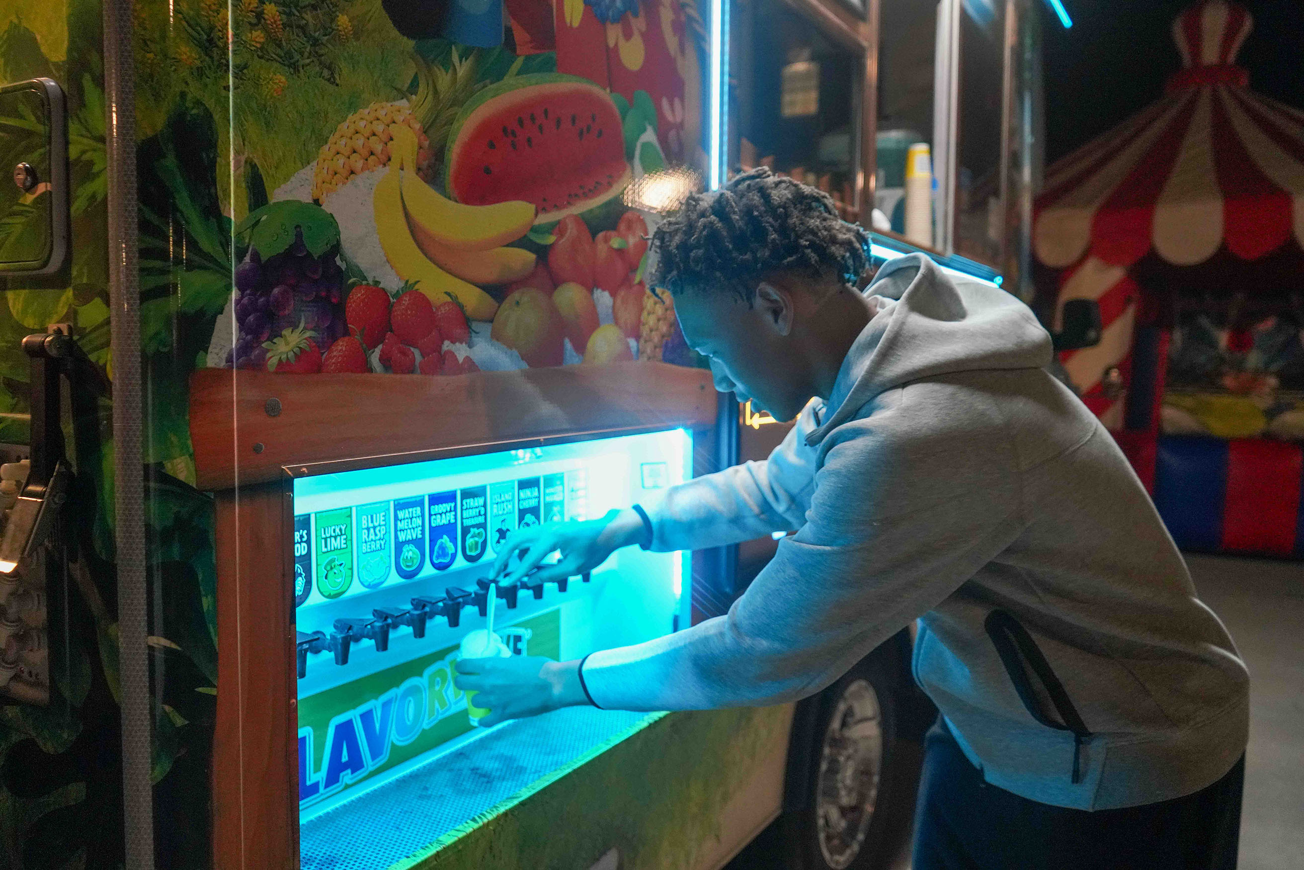 student getting snow cone at late night event