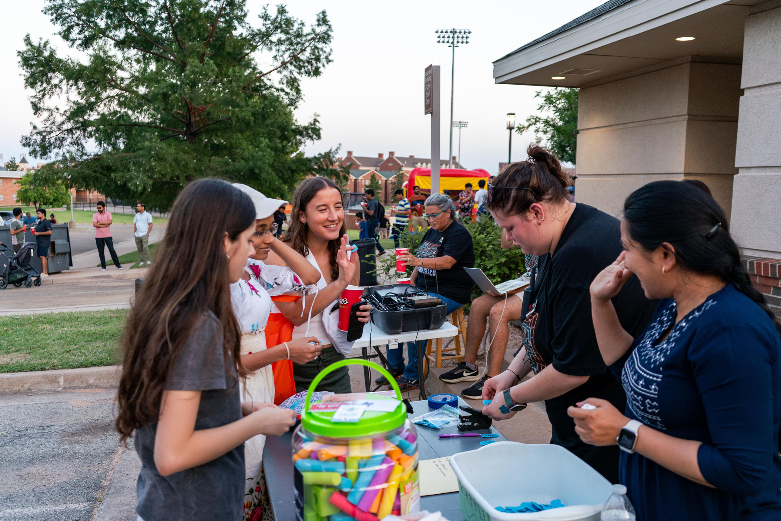 students in line smiling at fgsh welcome bash