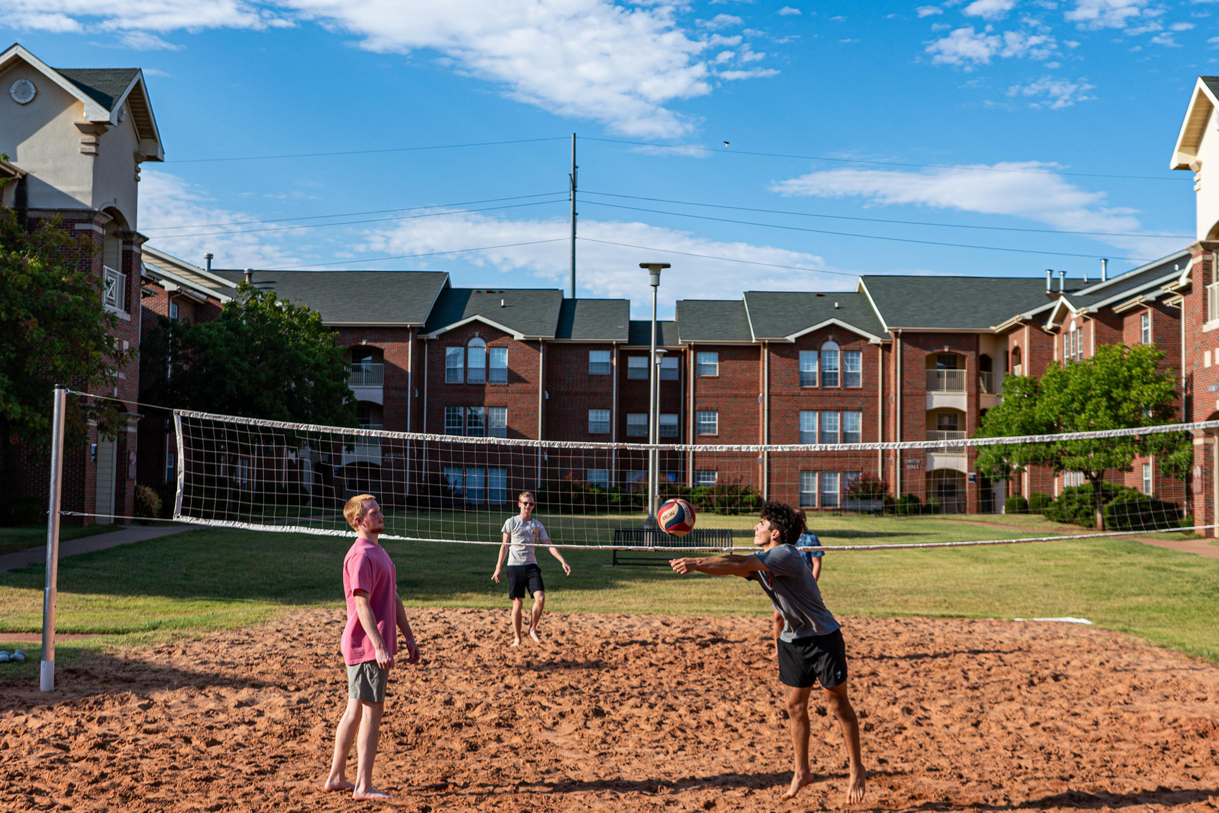 students playing volleyball at the villages