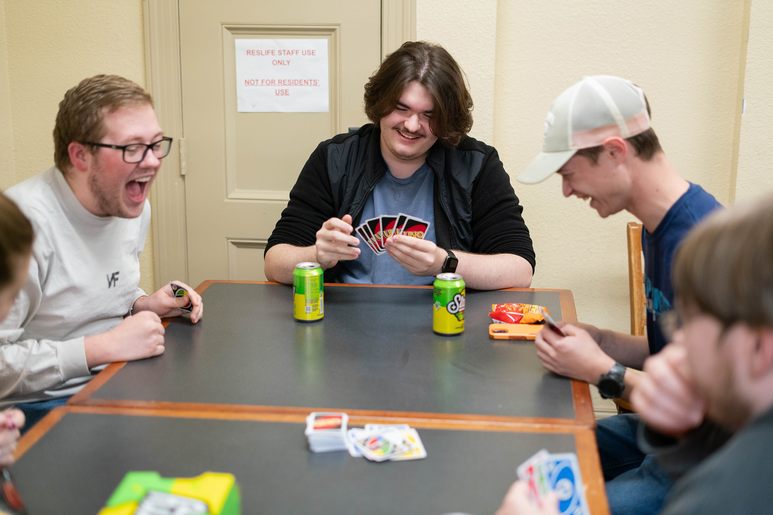students playing Uno and lauging