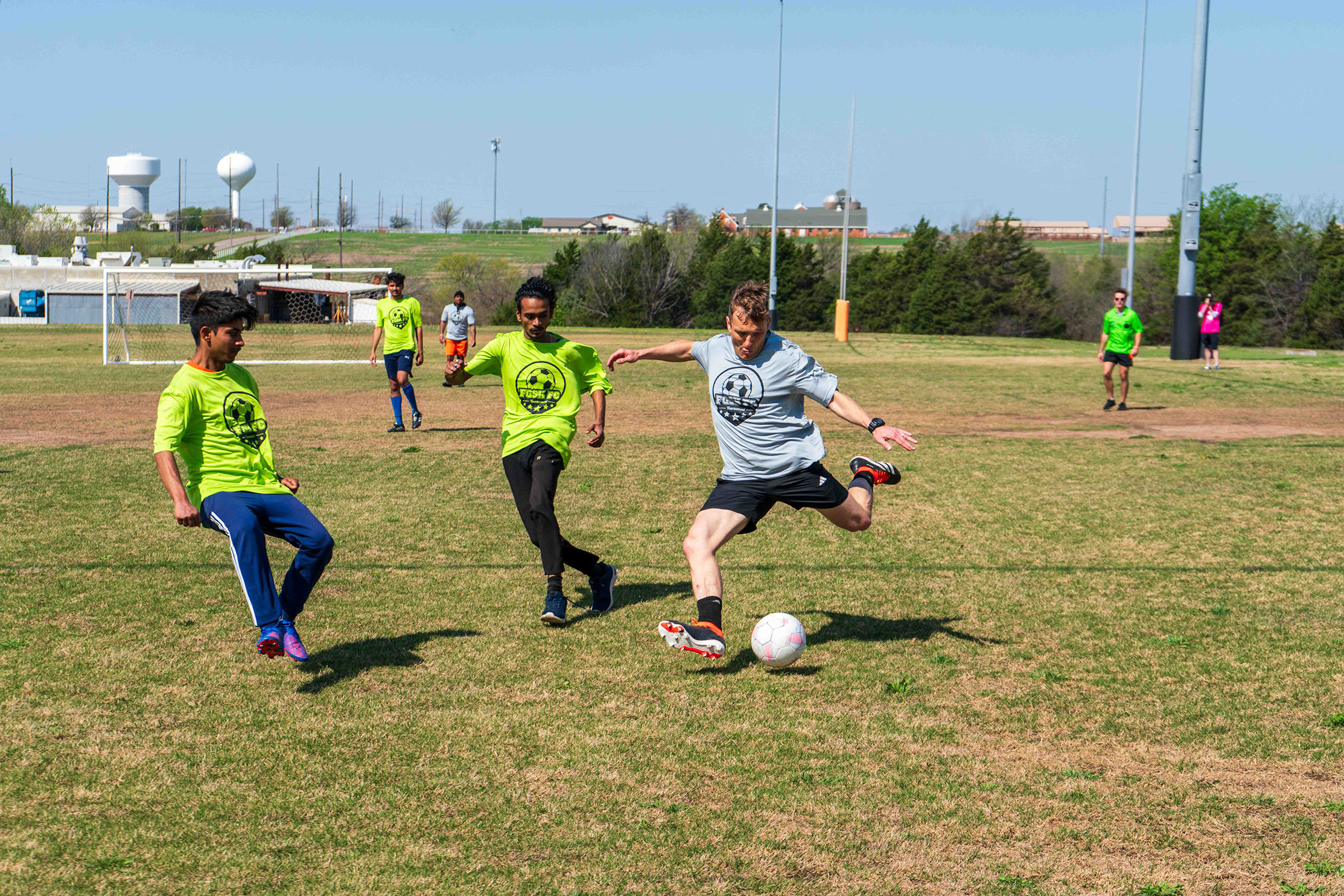 FGSH Soccer Tournament. student kicking ball
