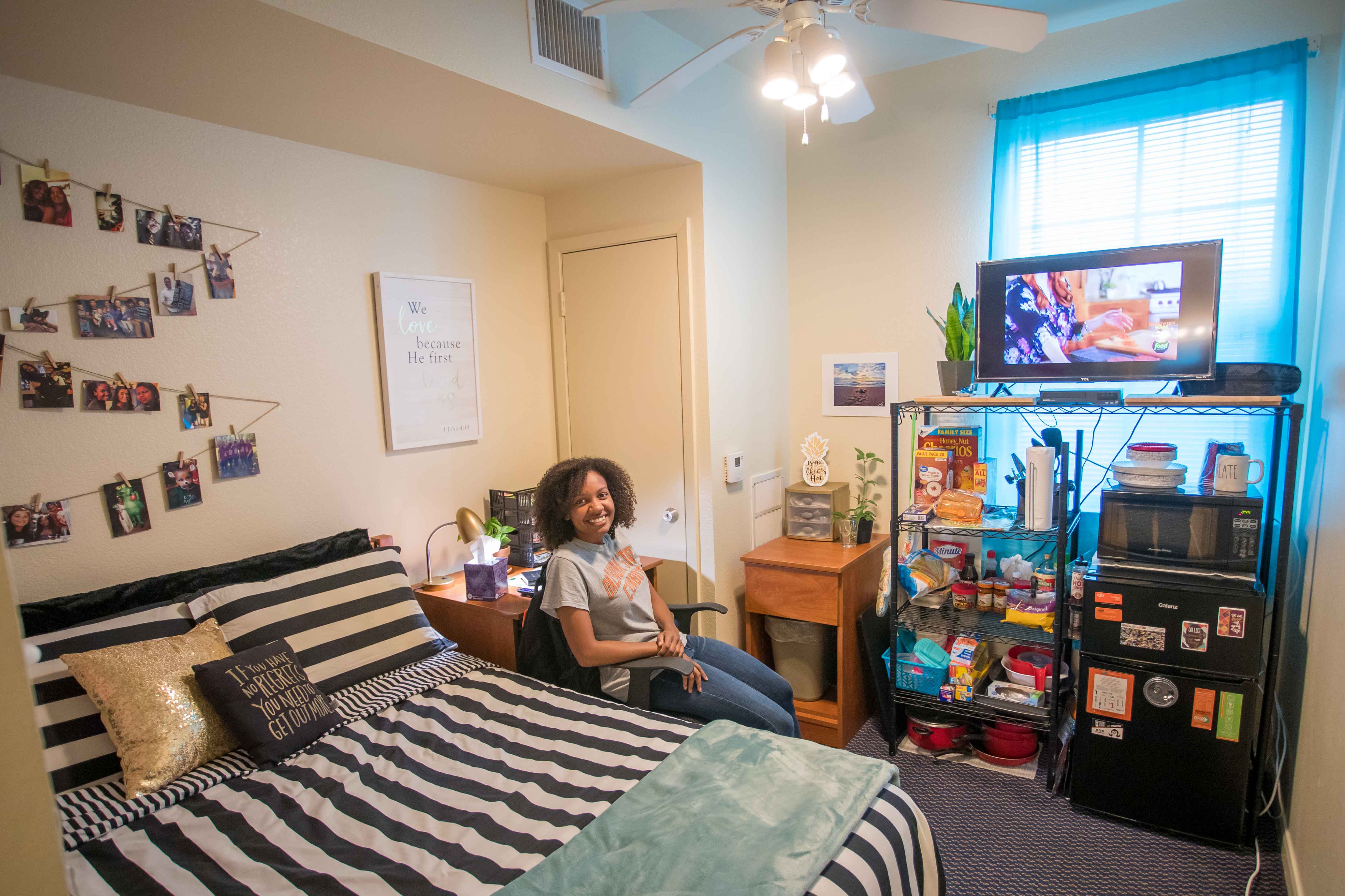 Village F resident in bedroom